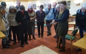 Medieval Study Group looking at old map